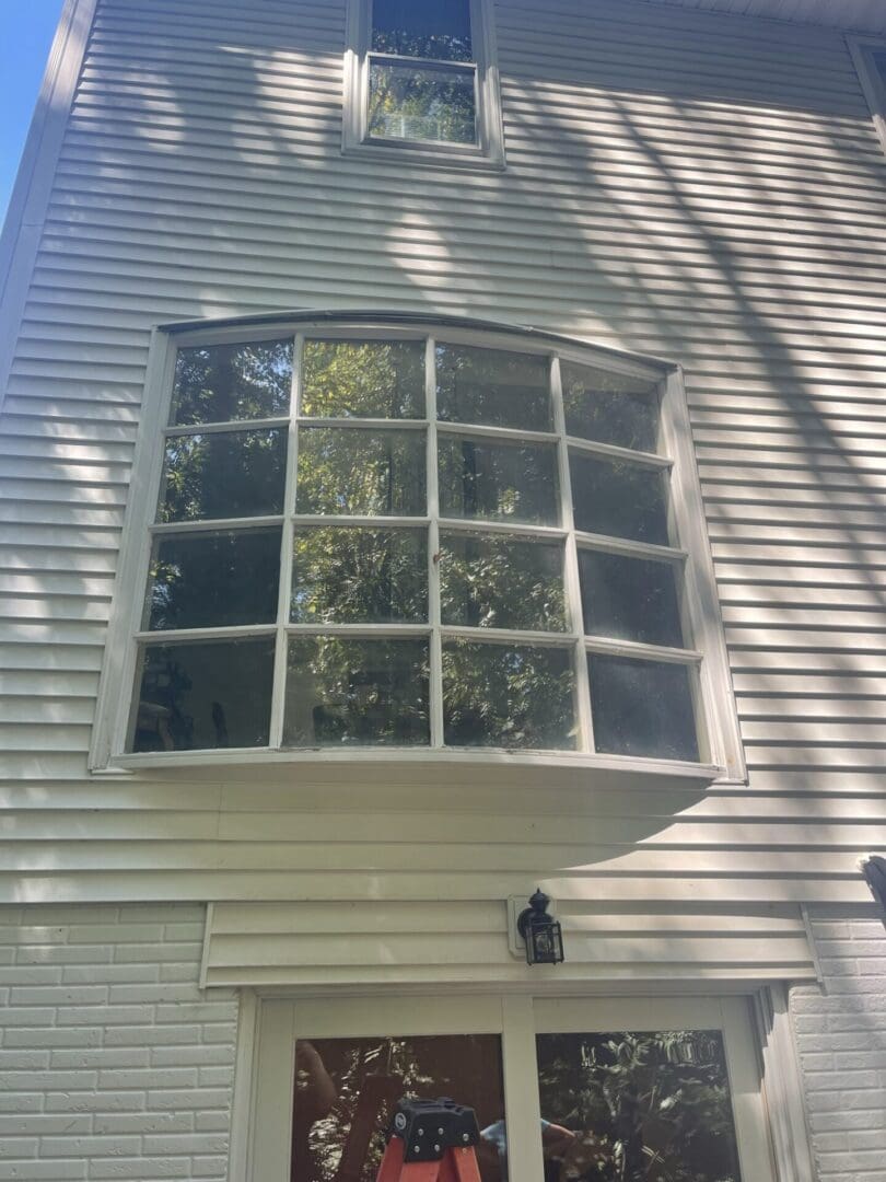A window that is in the middle of a house.