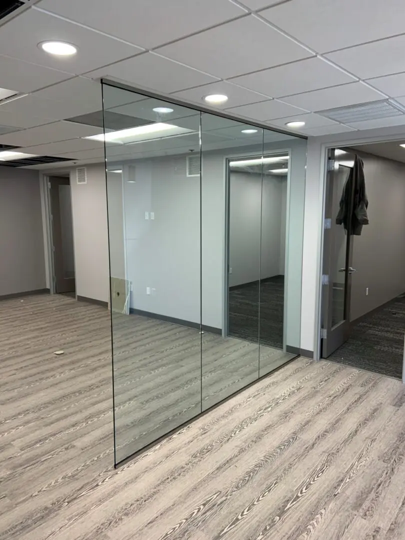 A room with glass walls and a mirror.